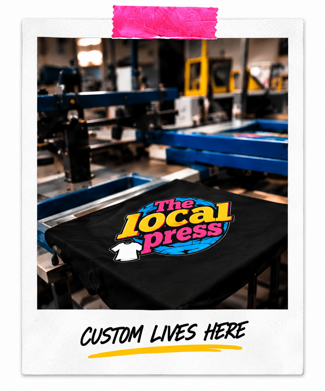 The Local Press logo shirt on a printing press. Custom lives here.